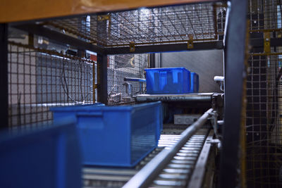 Blue boxes on conveyor belt