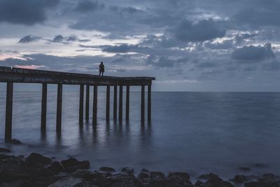 Pier on sea against sky