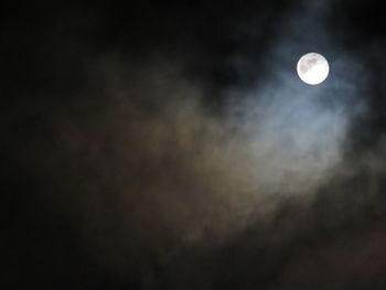 Low angle view of moon against sky at night