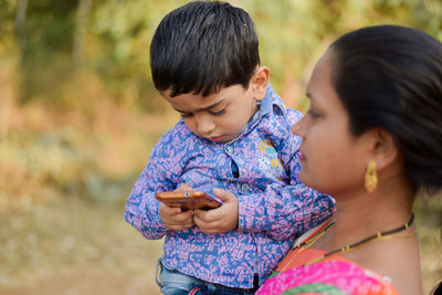 Boy using mobile phone