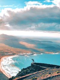 High angle view of sea and buildings against sky