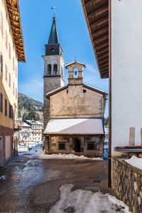 Buildings against sky during winter