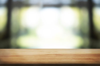Close-up of wooden table at home