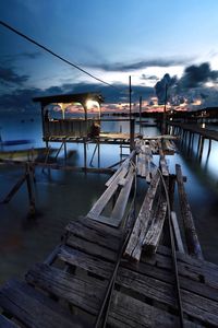 Pier on lake against sky