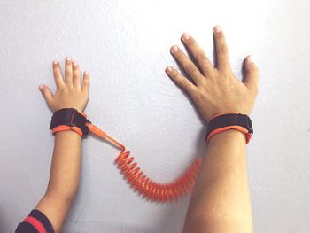 High angle view of hands holding white wall