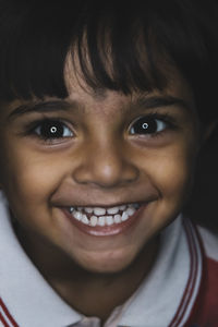 Close-up portrait of smiling boy