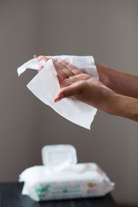 Midsection of person holding paper