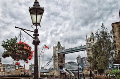 Low angle view of buildings against cloudy sky