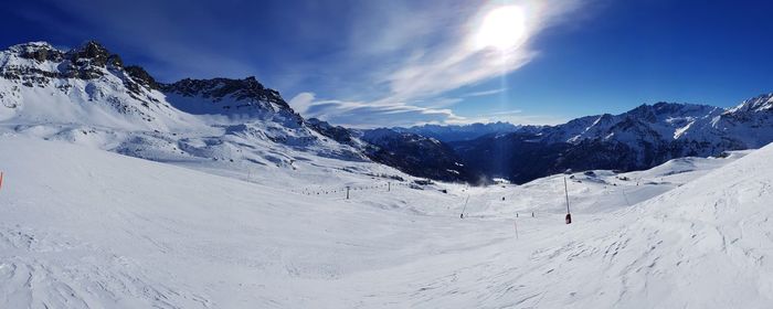 Scenic view of snowcapped mountains against sky