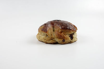 Close-up of bread against white background