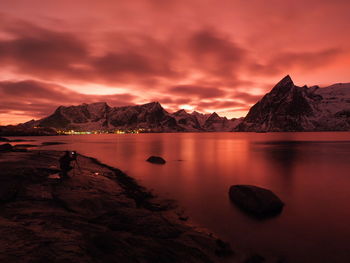 Scenic view of lake against sky during sunset