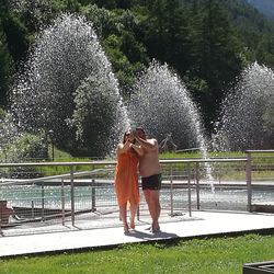 Full length of a woman standing on fountain at park