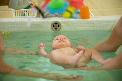 High angle view of baby boy in swimming pool