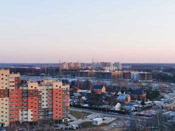 High angle view of buildings in city against clear sky