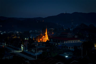 High angle view of illuminated buildings in city at night