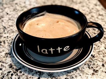 High angle view of coffee cup on table