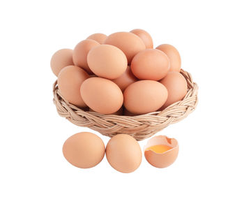 Close-up of eggs against white background