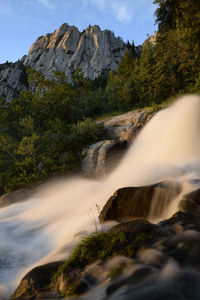 Evening light and waterfall below west bell tower in the wasatch mtns.