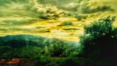 Scenic view of landscape against dramatic sky