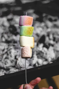 Close-up of hand holding ice cream cone