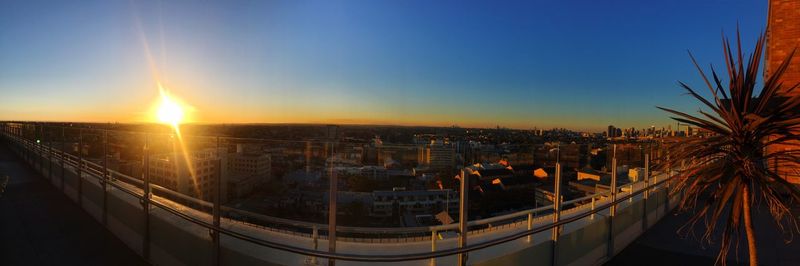 High angle view of buildings against sky during sunset