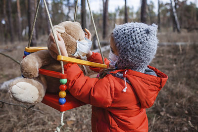 Full length of baby girl standing on land