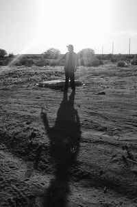 Full length of woman standing on landscape