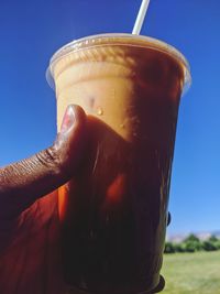 Close-up of hand holding drink