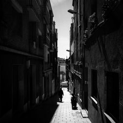 Man walking on street in city