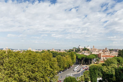 High angle view of trees and buildings against sky