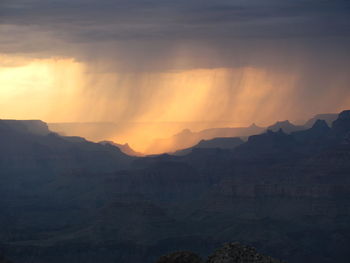 Scenic view of mountains against sky during sunset