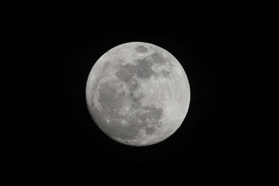 Low angle view of moon against clear sky at night