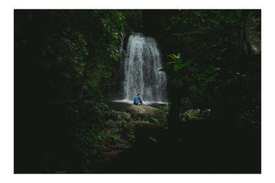 Beautiful girl in waterfall