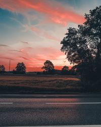 Scenic view of field against sky during sunset