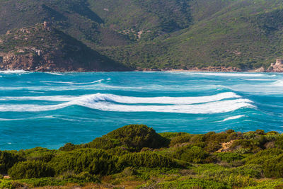 Scenic view of sea against mountains