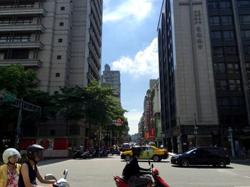 City street against cloudy sky