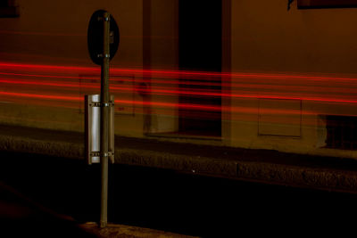 Close-up of illuminated railroad station platform
