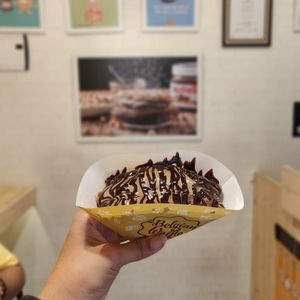 Close-up of hand holding ice cream