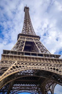 Low angle view of tower against cloudy sky