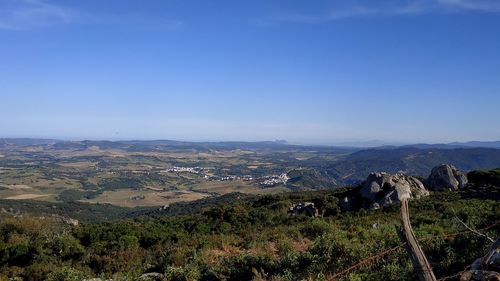 Scenic view of landscape against clear blue sky