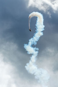 Low angle view of airshow against sky