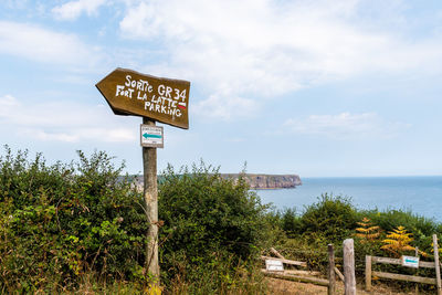 Signpost in the path to cap frehel and fort la latte. brittany, france