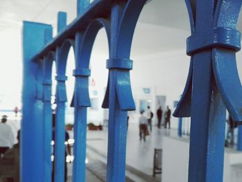 Close-up of cross against blue sky