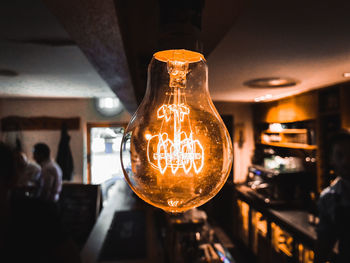Close-up of illuminated light bulb