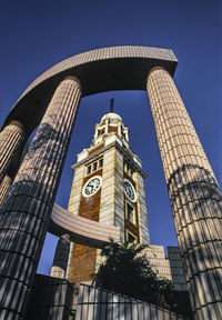 Low angle view of buildings against blue sky