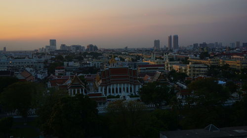 High angle view of buildings against sky during sunset