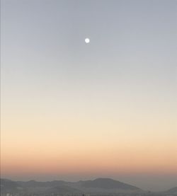 Scenic view of mountains against sky at sunset