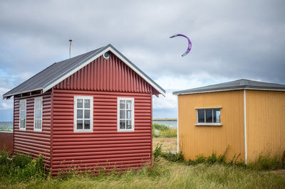 House on field against sky