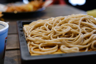 Close-up of noodles served in plate on table