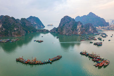 High angle view of boats in sea against sky